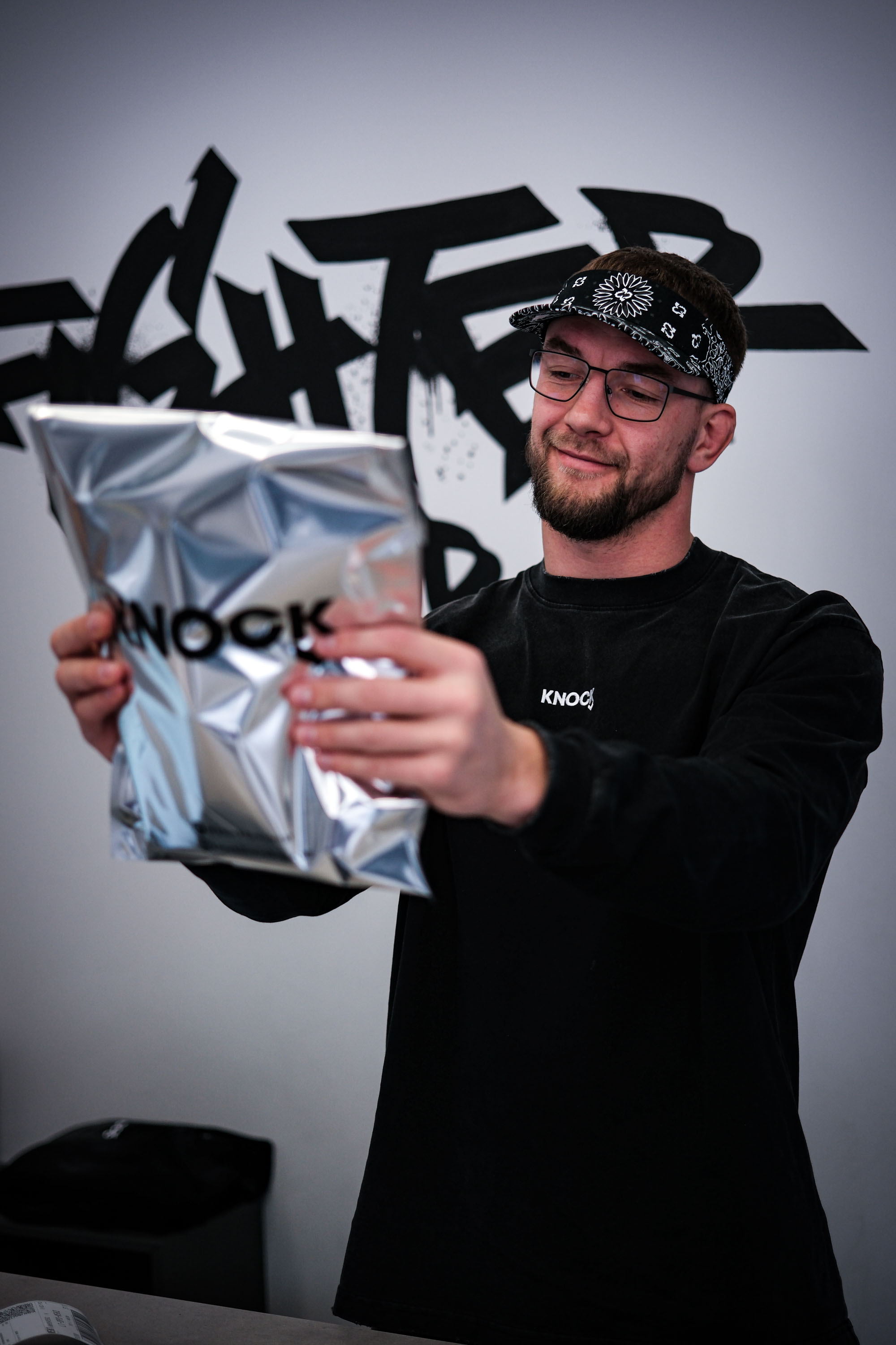 A member of the Knock team working on shipping